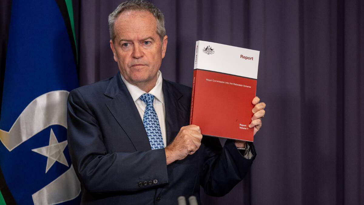 Government Services Minister Bill Shorten with the robodebt royal commission report. Picture by Gary Ramage