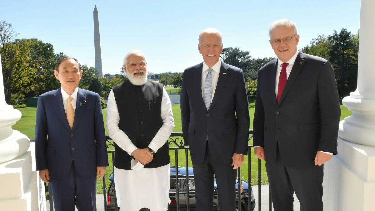 From left - former Japanese prime minister Yoshihide Suga, Narendra Modi, Joe Biden and Scott Morrison meeting in America earlier this year. Picture: Shutterstock