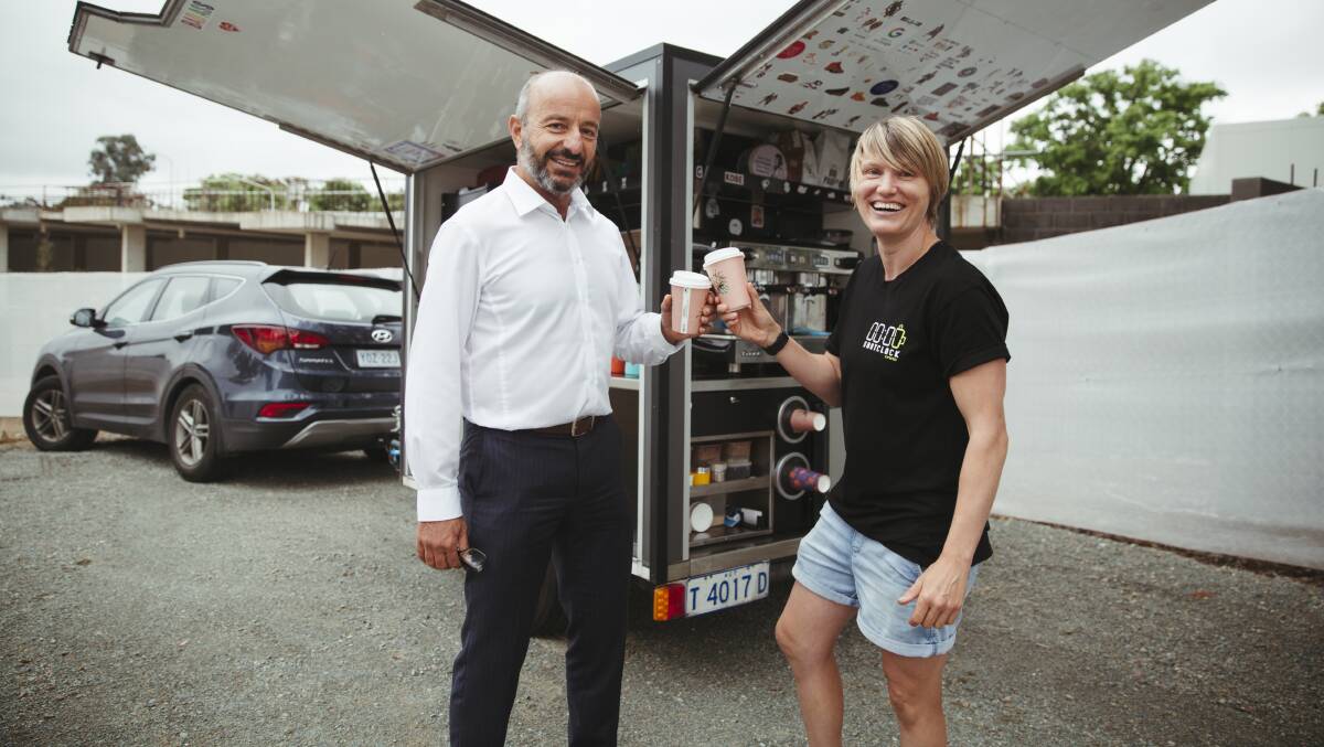 Dimitri Nikias with Shotclock co-owner Jess Bibby in front of her mobile coffee stall. Picture: Dion Georgopoulos
