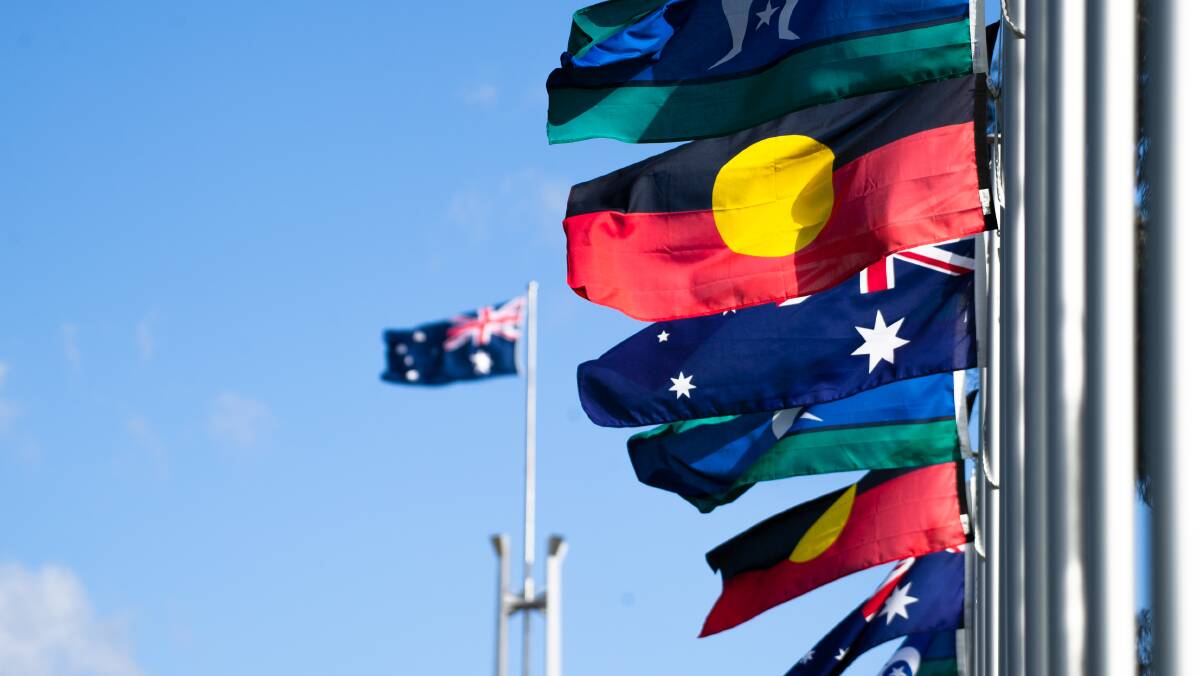 Aboriginal, Torres Strait Island, and Australian flags flying in Canberra. Picture by Elesa Kurtz