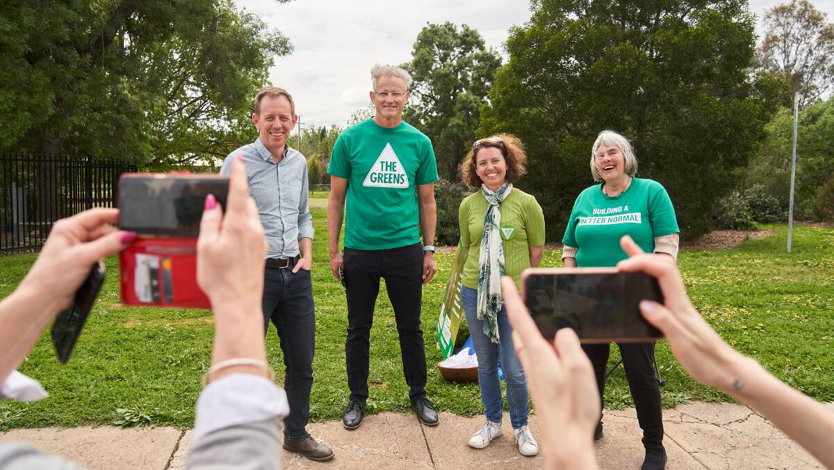 Shane Rattenbury (left) poses for a photo on election day. Picture: Matt Loxton