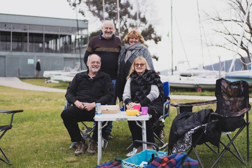 Steve and Tanya Keeling (back) with Andrew and Jan Lockley catching up for fish and chips outside the Canberra Yacht Club. Picture: Dion Georgopoulos 