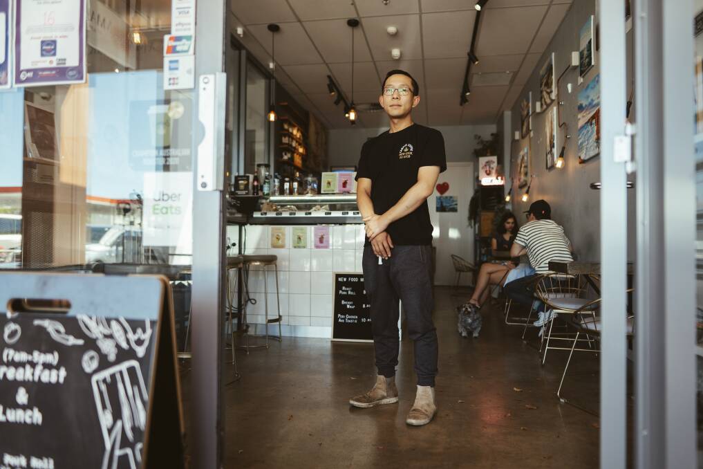 Owner of Folks Gallery Cafe in Dickson, Vincent Chen, was a victim of racist verbal abuse after a confrontation outside his cafe. Picture: Dion Georgopoulos