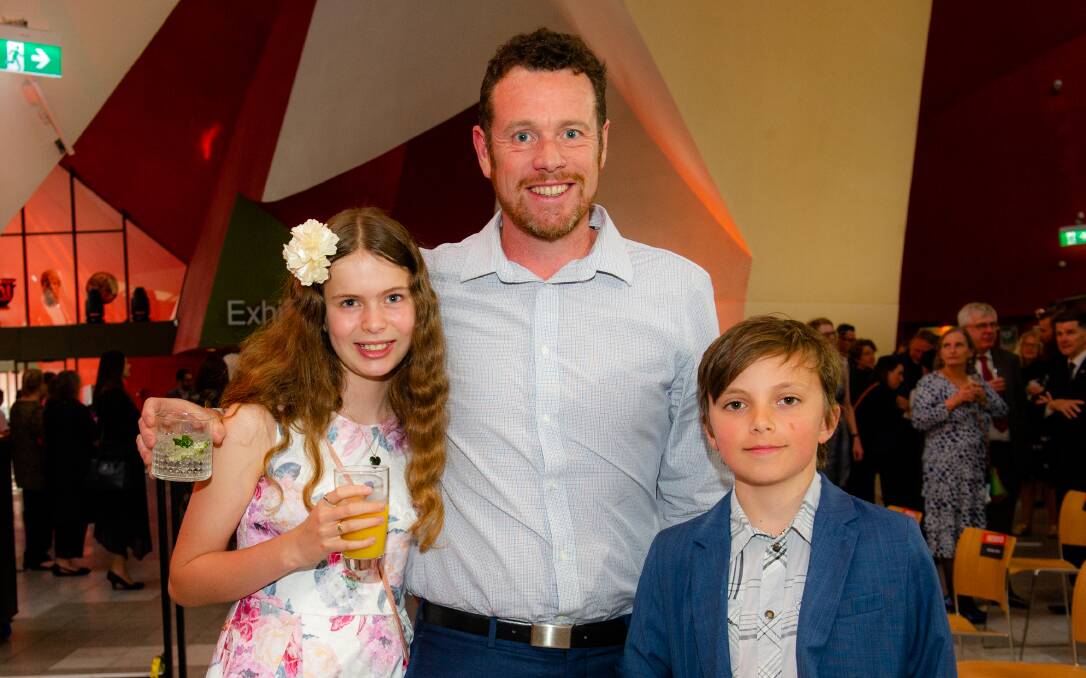 Lucia and Andrew McFadzean of Watson with Ethan Jones of Ainslie.