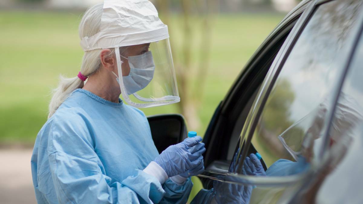 A COVID-19 mobile testing station healthcare worker in full protective gear. Photo: Shutterstock