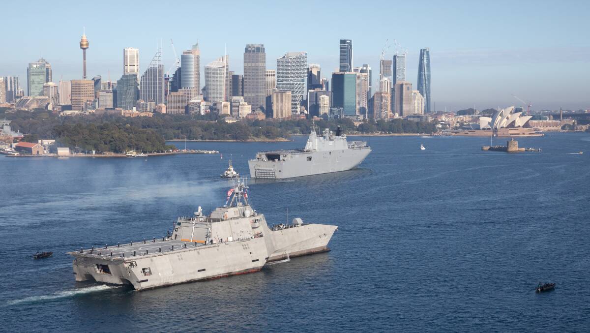 HMAS Canberra escorts USS Canberra into Sydney Harbour prior to her commissioning. Picture Defence