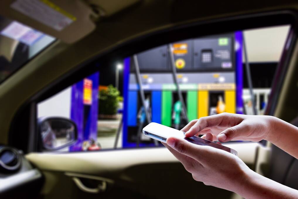 The Australian Transport Safety Bureau warns that mobile phones can lead to driver distraction during refueling. Picture: Shutterstock