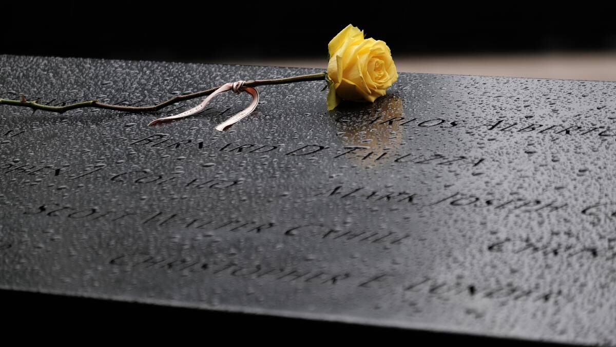 Flowers placed over names at the September 11 Memorial on September 9, 2021, in New York City. Picture: Getty Images