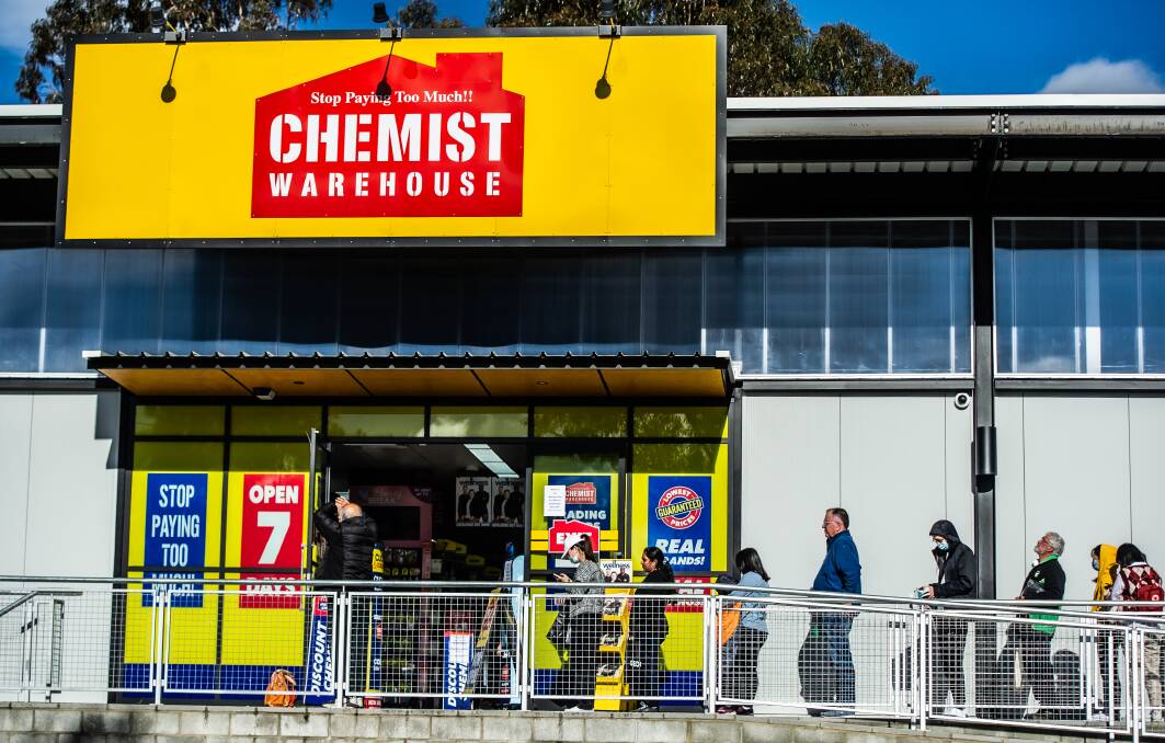 Queues form at Chemist Warehouse in Belconnen on the first day of the ChooseCBR voucher relaunch. Picture: Karleen Minney