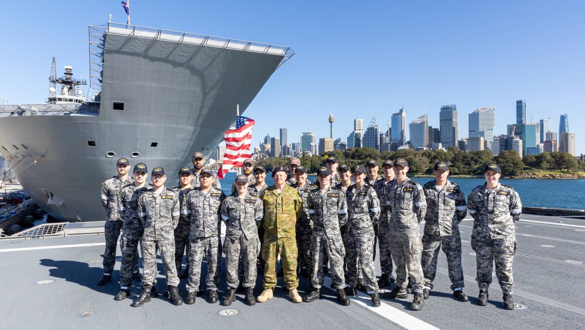 Members of HMAS Canberra on the flight deck of USS Canberra alongside Fleet Base East, Sydney, NSW. Picture Defence
