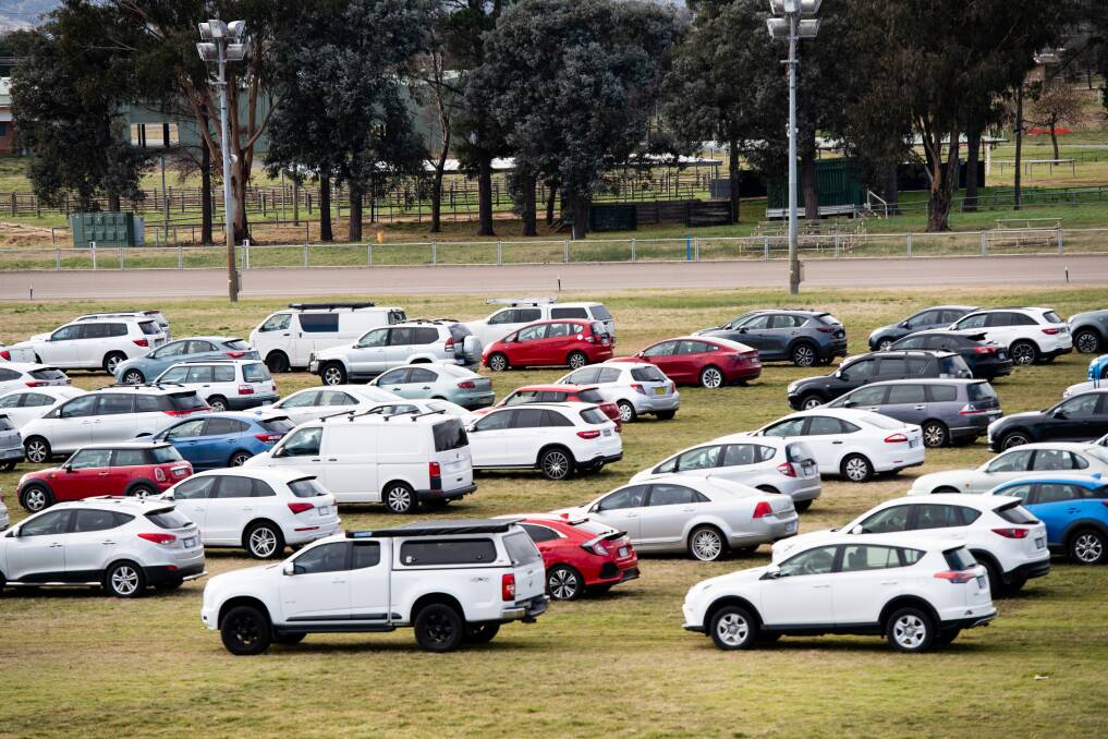 Canberrans lined up for Covid testing at the EPIC location wait for hours on the centre showground before making it to the testing centre on Monday. Picture: Karleen Minney