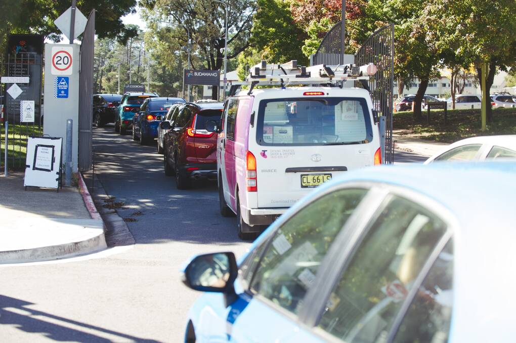 Cars lined up for testing at EPIC on Monday, following ACT Health directions on the Brisbane COVID outbreak. Picture: Dion Georgopoulos