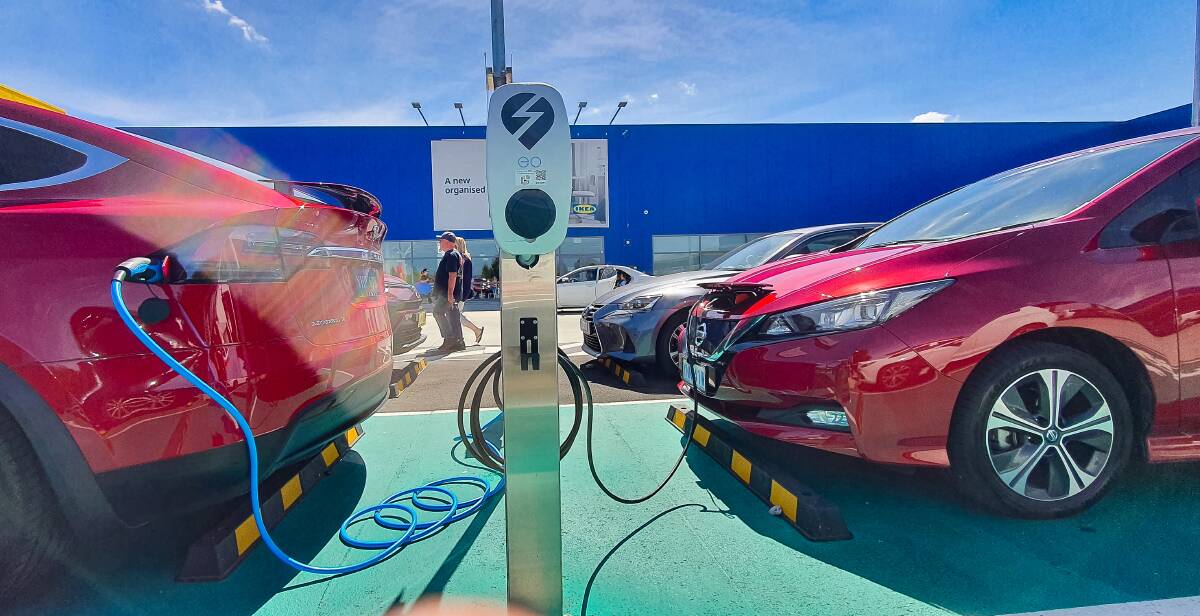 Electric vehicles at a charging station. Picture: Sitthixay Ditthavong