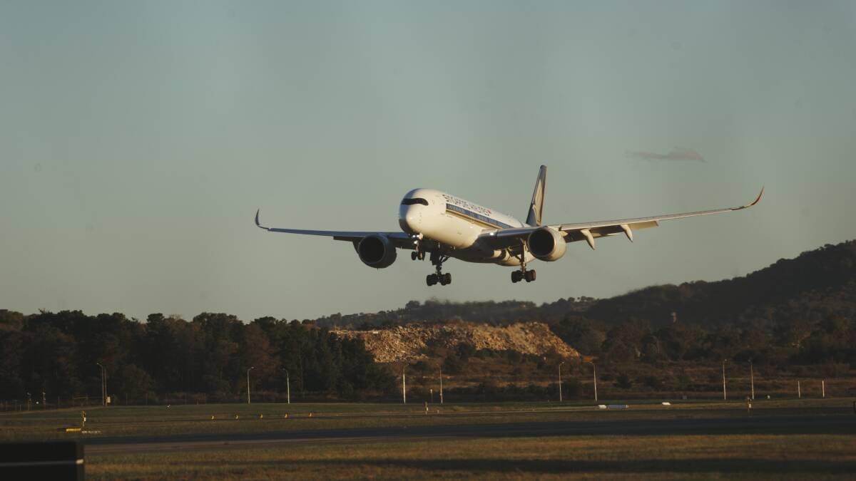 A repatriation flight lands in Canberra earlier this year. Picture: Dion Georgopoulos