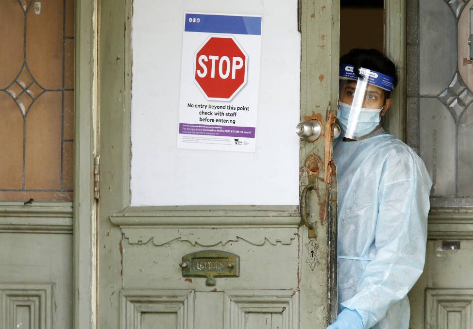 A health worker at Hambleton House, where residents have been evacuated after an outbreak of coronavirus. Picture: Getty Images