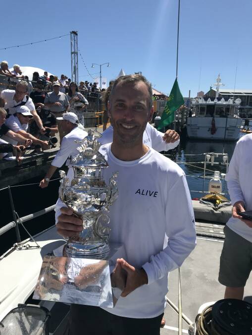 Canberra sailor Shane Gaddes with the trophy he won on Alive as the 2018 overall winner. 