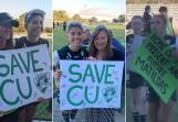 Canberra United players, and ACT Sports MInister Yvette Berry, pose for photos with signs calling for action to save the ALW club. Pictures supplied