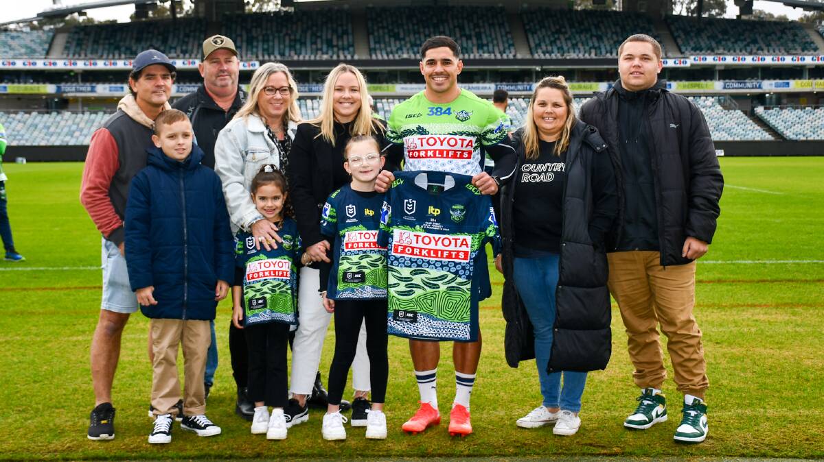 Raiders halfback Jamal Fogarty's family presented his jersey ahead of his Green Machine debut. Picture: Raiders Media