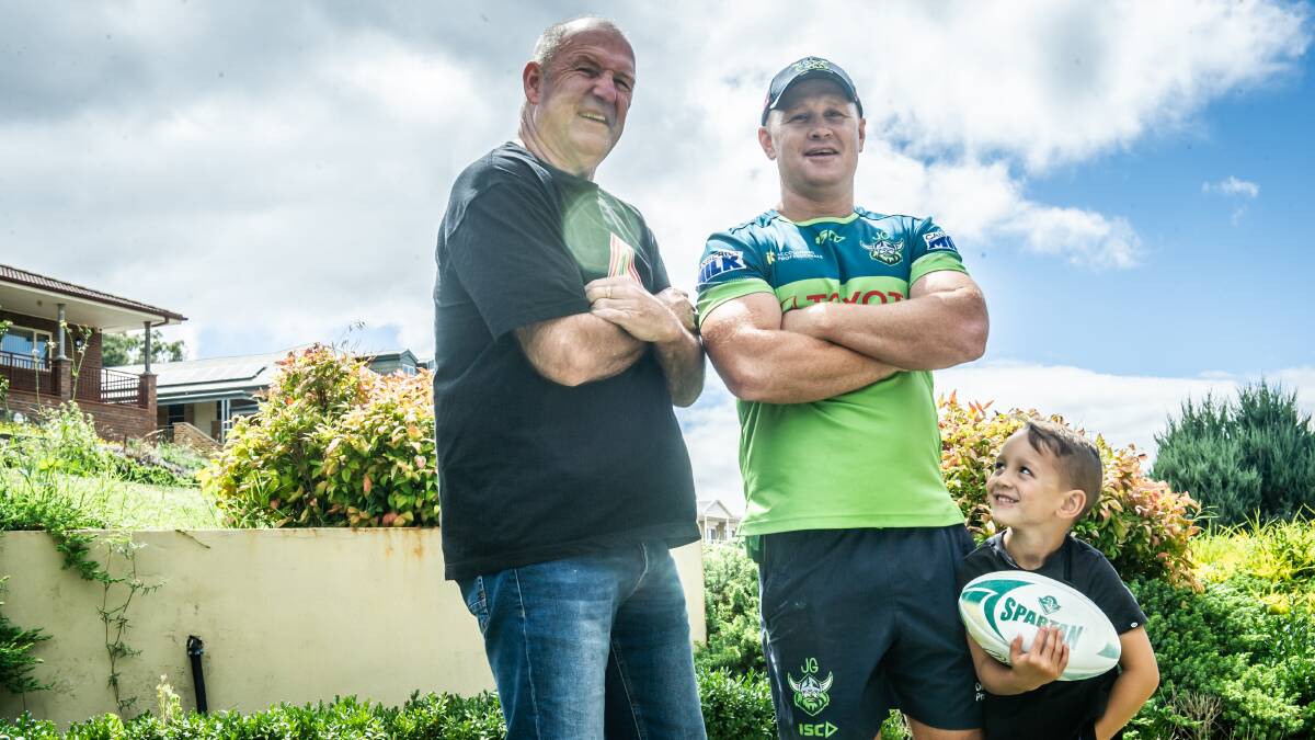 Three generations of Giteau - dad Ron, Justin and and son Joshua - celebrate Justin's appointment. Picture: Karleen Minney