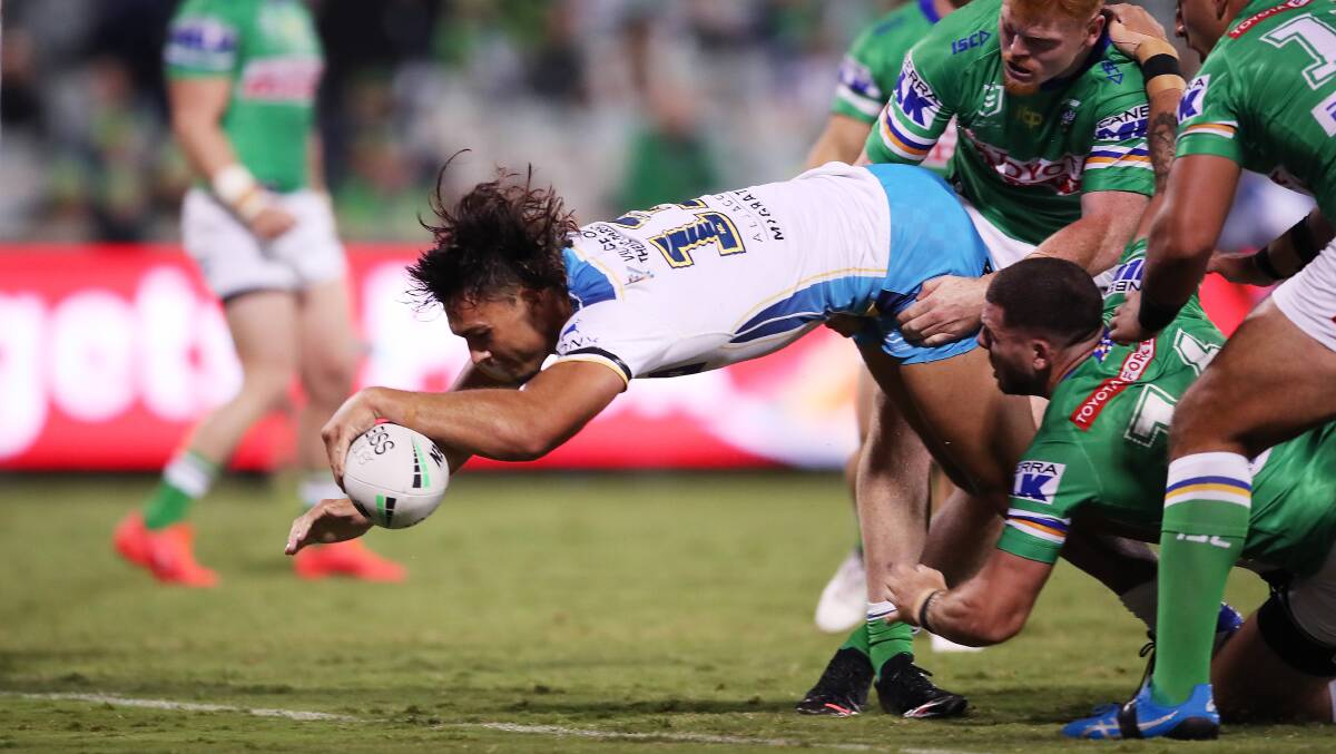 Tino Fa'asuamaleaui crashes over as the Titans looked on track for a big win. Picture: Getty Images