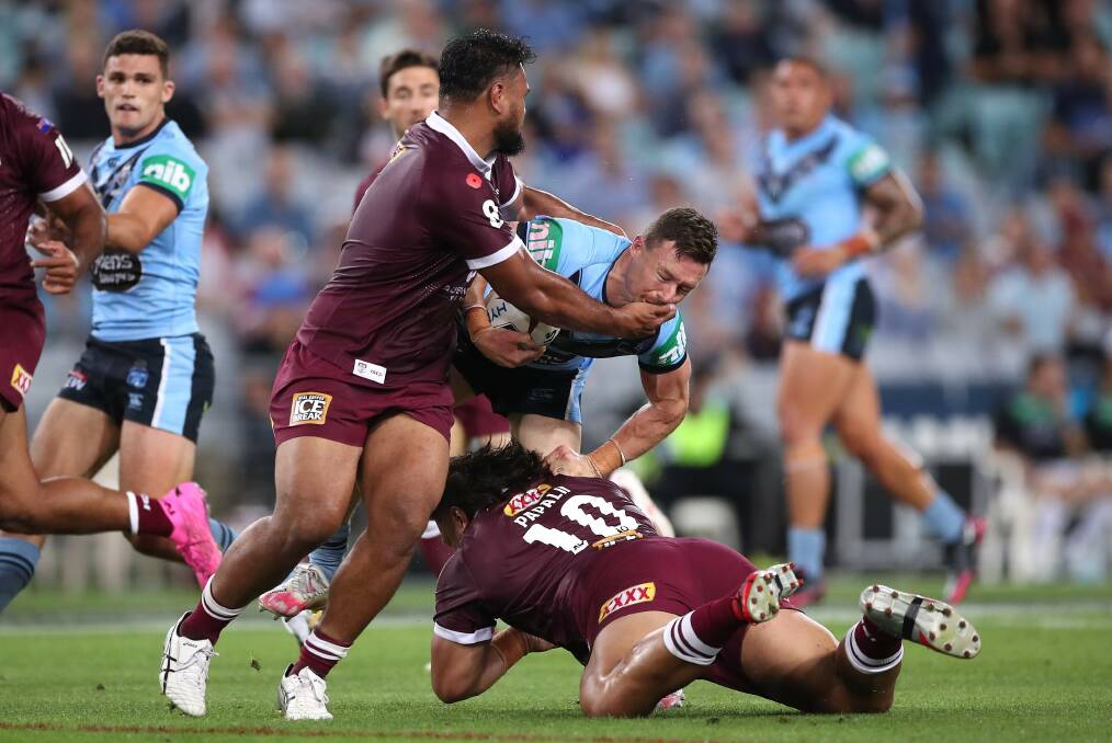 Maroons prop Dunamis Lui lays a tackle in his emotional Origin debut. Picture: Getty Images