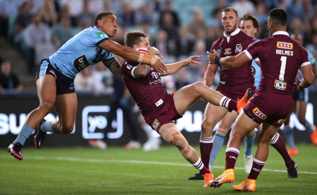Maroons five-eighth Cameron Munster is expected to be OK for game three after he was forced off with concussion. Picture: Getty Images