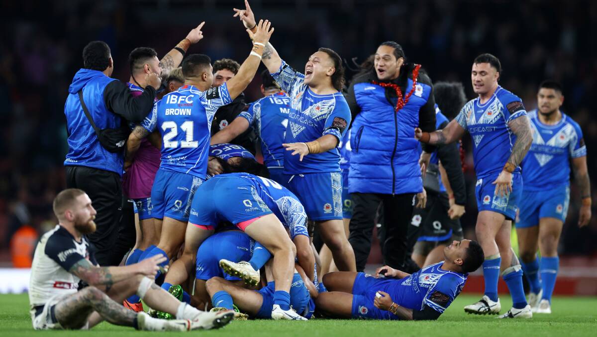 Raiders and Samoa prop Josh Papalii celebrates the historic win over England that has him on a collision course with his Green Machine teammate Jack Wighton in the World Cup final. Picture Getty Images