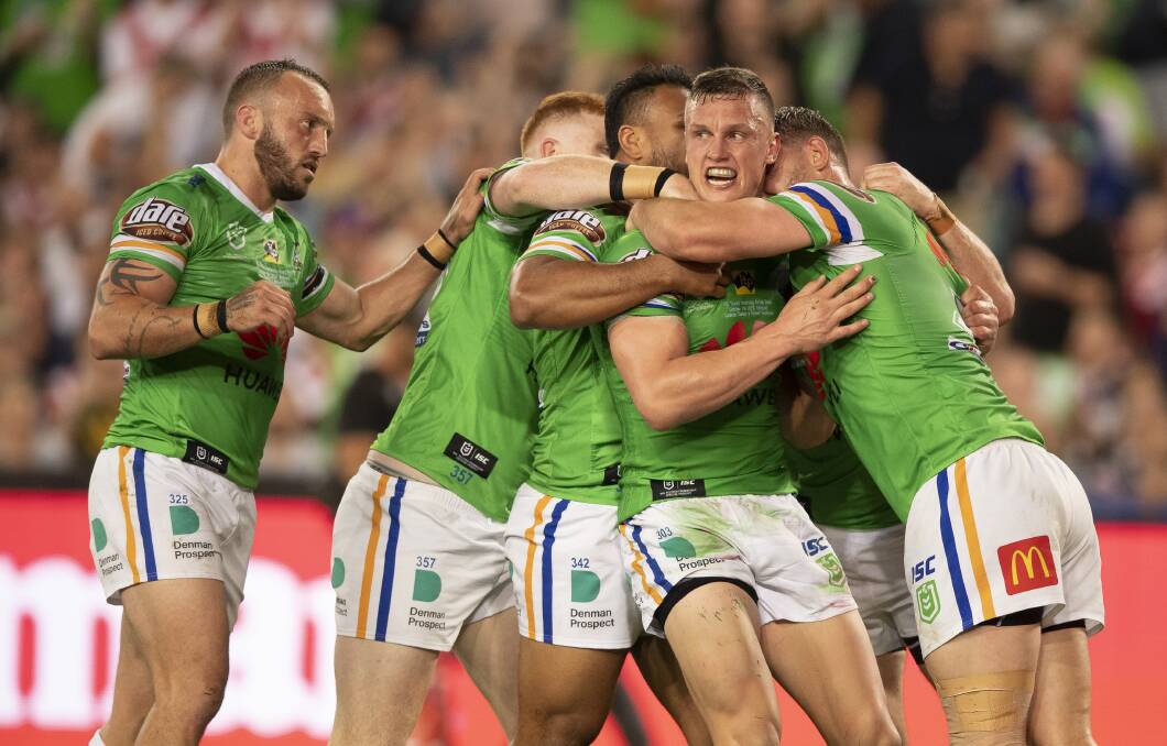 The Raiders flock to Jack Wighton after his try. Picture: Sitt Ditthavong