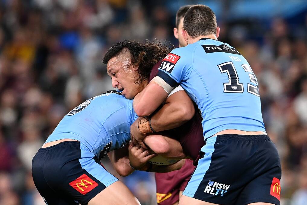 Josh Papalii takes on the Blues' defence on Wednesday night. Picture: Getty Images