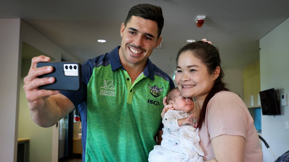 Raiders halfback Jamal Fogarty takes a selfie with Mu Dah and her son Raphael. Picture by James Croucher