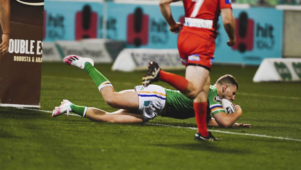Raiders halfback George Williams scored his first NRL try. Elliott Whitehead, below, hurt his knee in the win. Pictures: NRL Imagery, Dion Georgopoulos