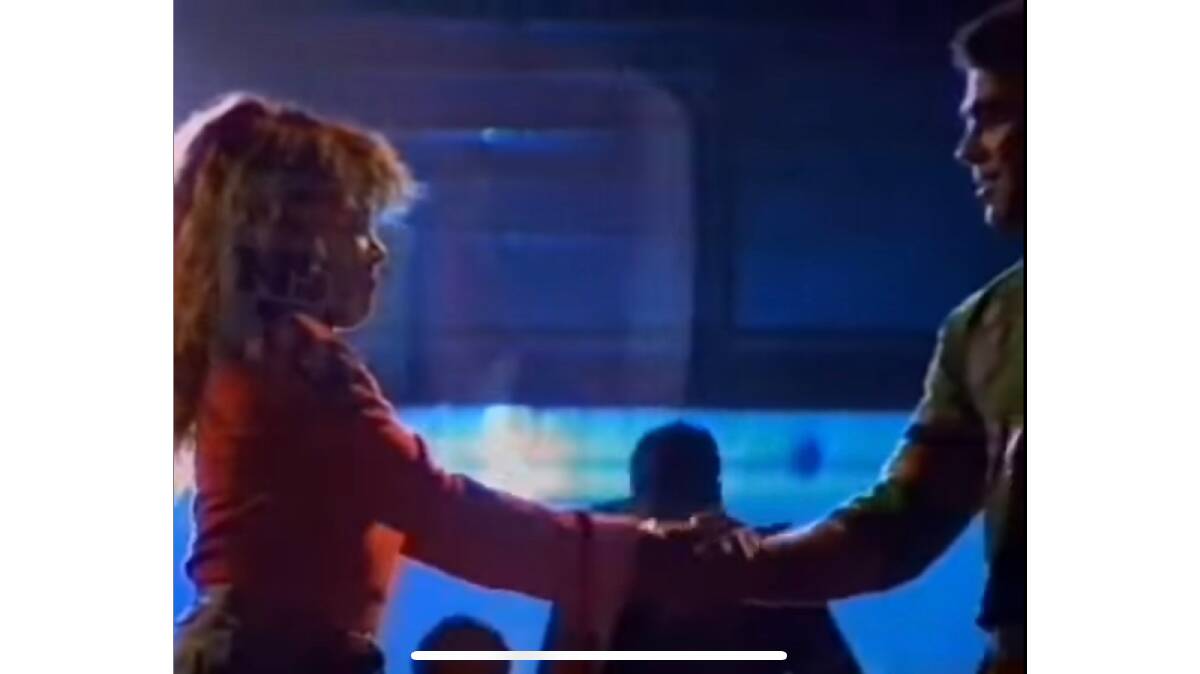 Raiders legend Mal Meninga shakes hands with the late, great Tina Turner in the blockbuster ad Simply The Best. Picture screenshot