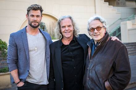 Mad Max Furiosa star Chris Hemsworth, producer Doug Mitchell and director Dr George Miller in Sydney in April. The production company behind the Mad Max series says it will not start filming in Hay until June or July next year. Picture: Screen NSW.