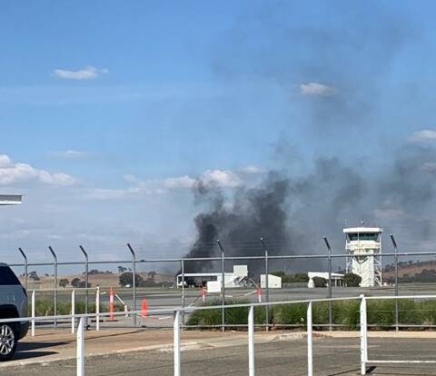 CRASH LANDING: The two-seater plane caught fire mid-air before crash landing at Wagga Airport. Picture: Supplied