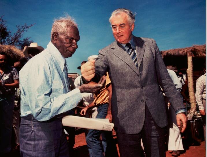 Mervyn Bishop "Prime Minister Gough Whitlam pours soil into the hands of traditional owner Vincent Lingiari, Northern Territory, 1975". Art Gallery of NSW Hallmark Cards Australian Photography Collection Fund 1991. Copyright - Mervyn Bishop/Department of the Prime Minister and Cabinet.. Photo: AGNSW
