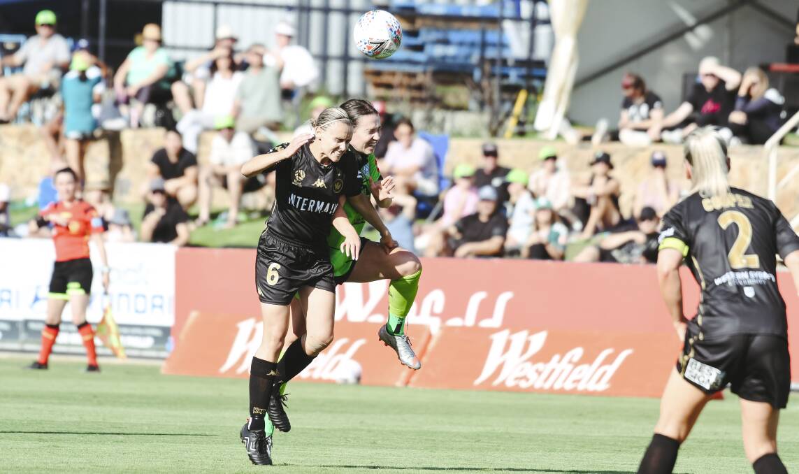 Grace Maher contests the ball against former Canberra United midfielder Olivia Price. Picture: Dion Georgopoulos