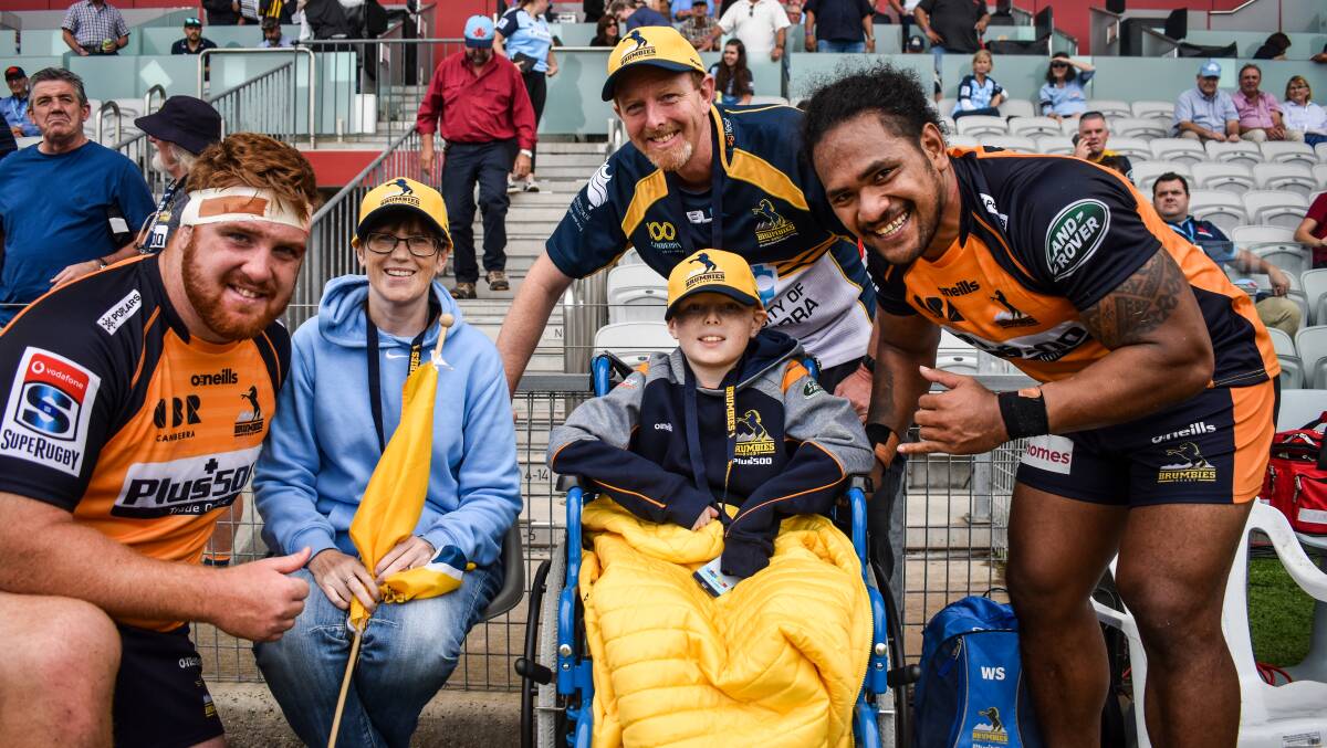 The Franklin family sitting on the sidelines, pictured with Tom Ross and Solomone Kata. Picture: Brumbies Media