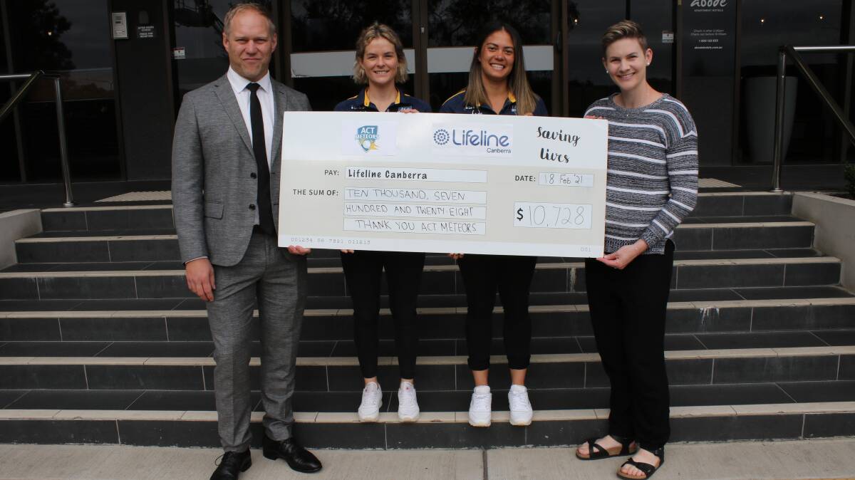 Abode Hotels GM Rien Donkin, Meteors Katie Mack and Angela Reakes present Lifeline Canberra spokesperson Mel Breen with the cheque. Picture: Cricket ACT
