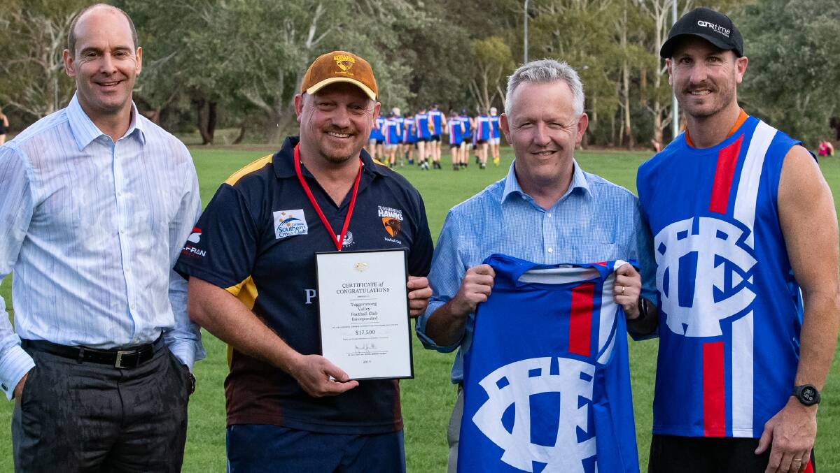Tuggeranong Valley AFC board member Luke Jess, club president Leo Lahey, and head coach Jim Rice, with new club patron David Smith. Picture: Supplied