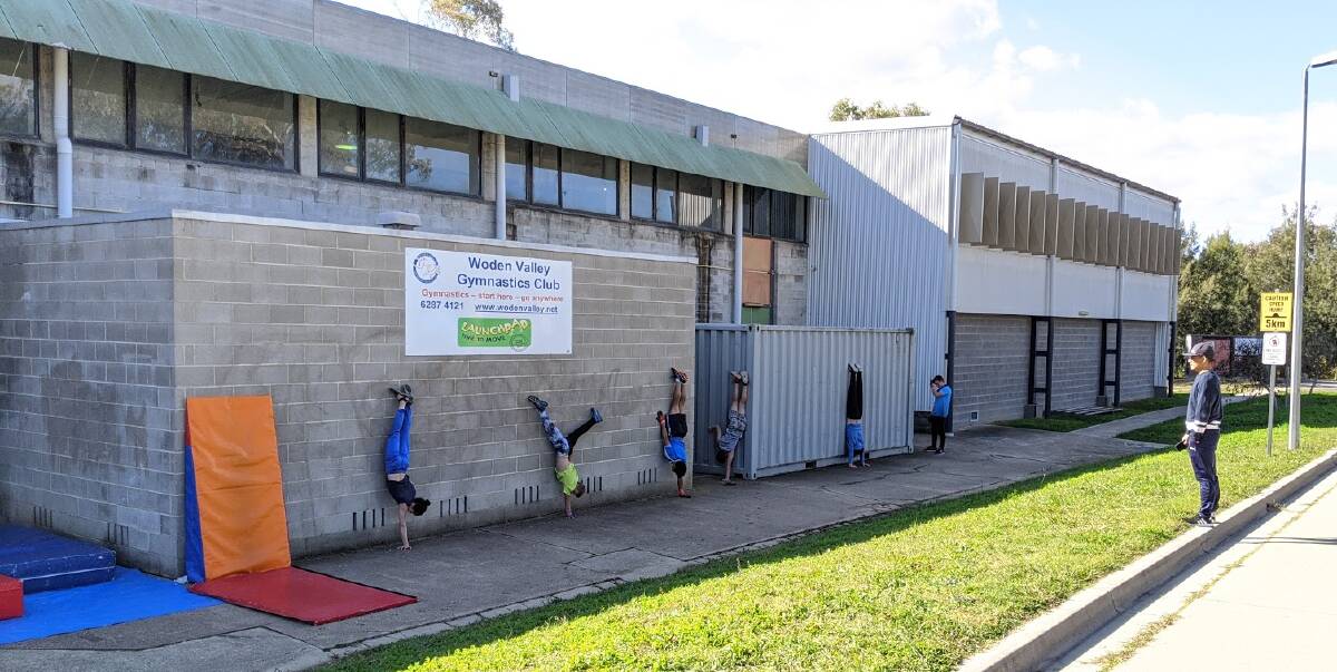 The senior boys class do handstands outside the club's facilities. Picture: Supplied
