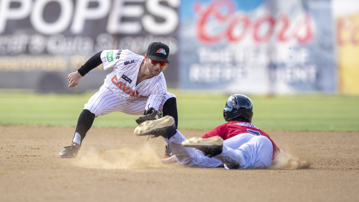Cavalry's Mickey Reynolds tags out Melbourne Aces' Reece Longstaff during the third game of their weekend series. Picture: Keegan Carroll