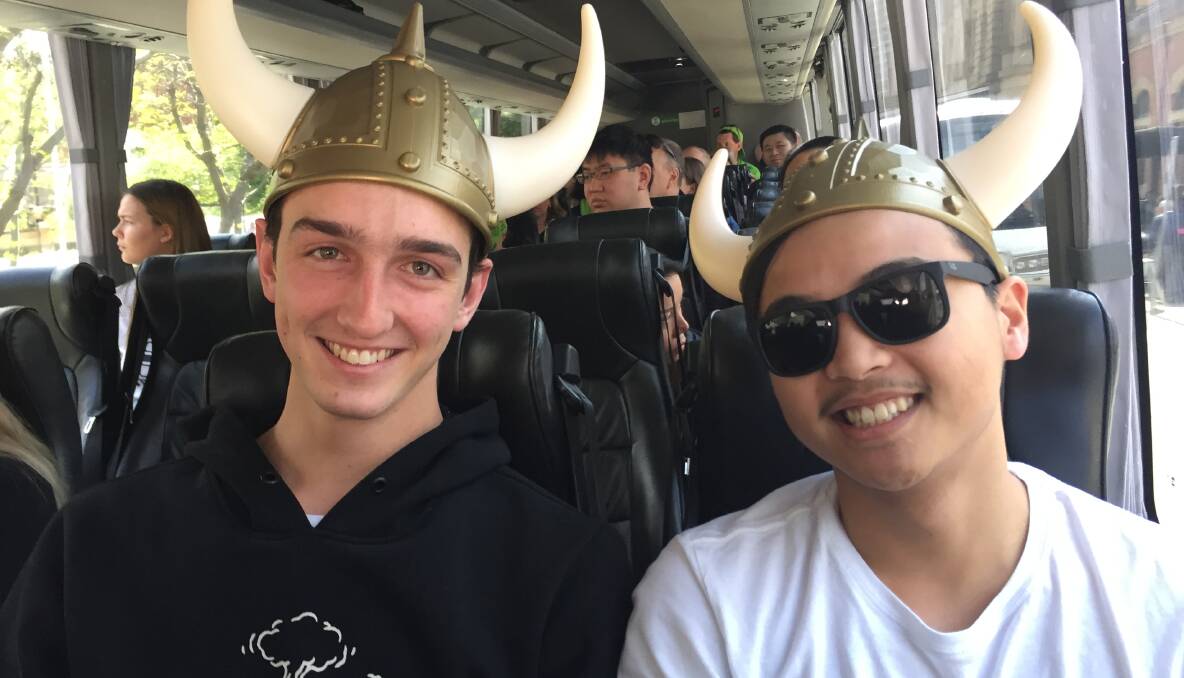 Raiders fans Tom Michie and Brendan Ly on the bus to Sydney. Picture: Lucie Bertoldo