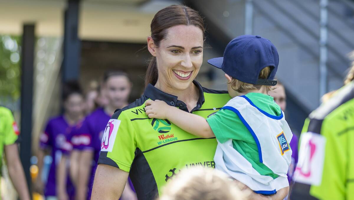 Jessie Rasschaert and her son Tristan at Canberra United's season opener. Picture: Michael Daniel Photography