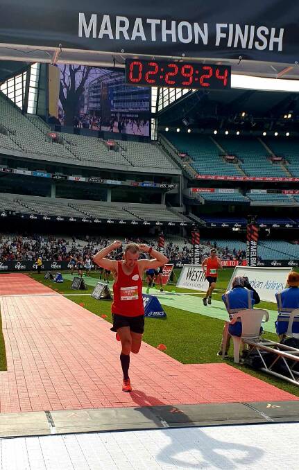 Shaun Creighton crosses the finish line at the Melbourne Marathon. Picture: Supplied