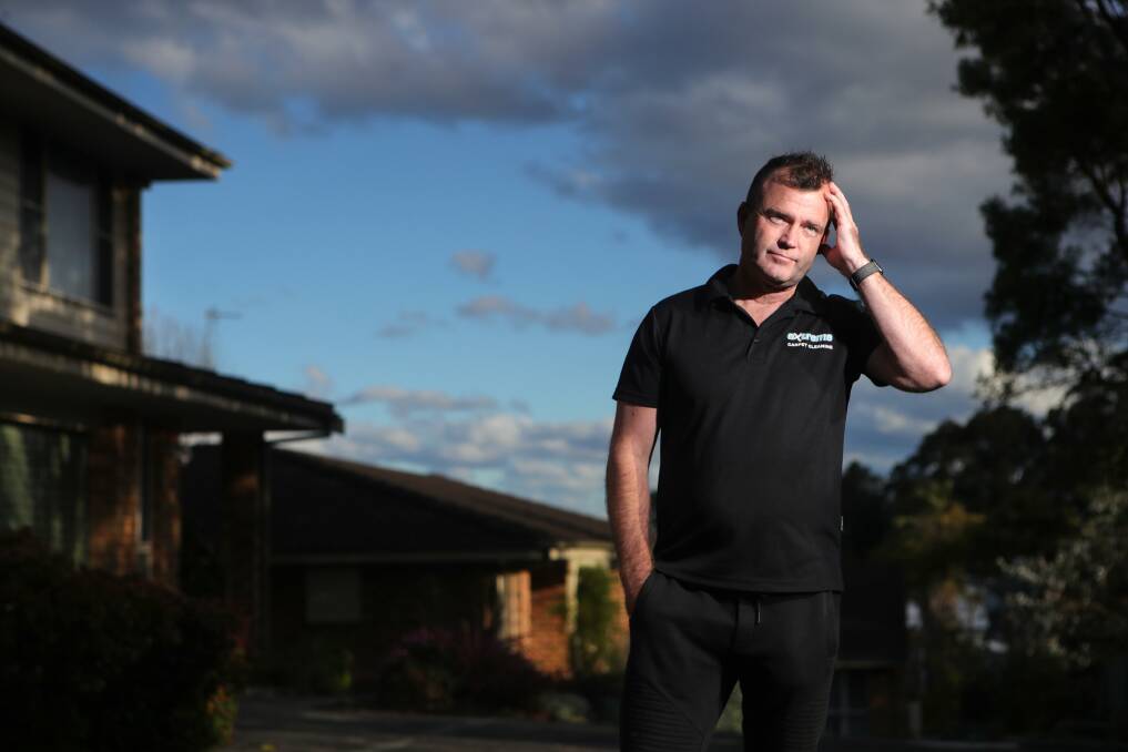HAND UP: Woonona business owner Wayne Cooke says the business relief grants have been slow to arrive, putting pressure on local business owners. 