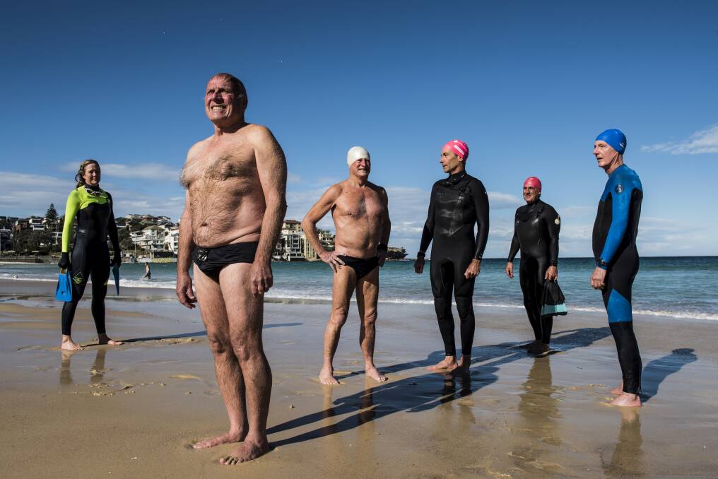 Bondi swimmers Paul Ure (front) with Melinda Selby, Chris Selby, Peter Kuner, Gavin Thomson, Daniel Martin at Bondi Beach. Photo: Steven Siewart