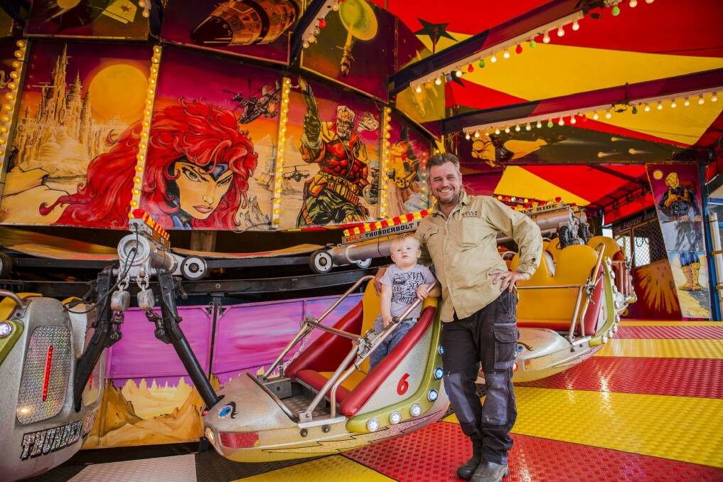 The Royal Canberra Show will be open on Friday. Elwin Bell of Bells Amusements with his grandson Boston Brophy 22-months-old. Photo: Jamila Toderas