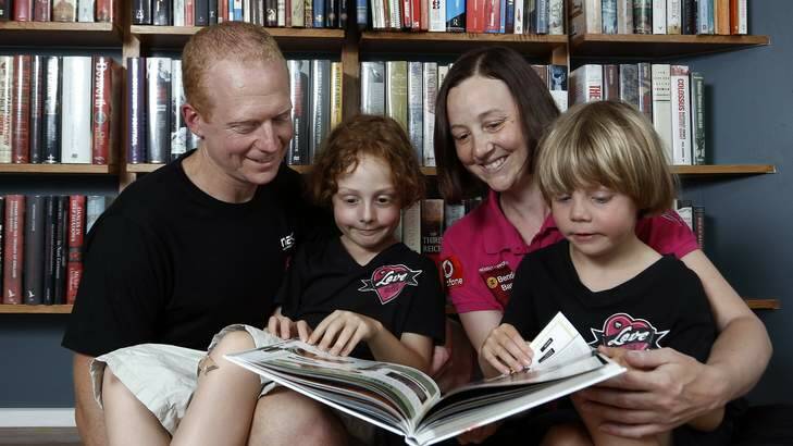 Mike,  Willoughby, Connie and Hamilton reading at home in Kingston. Photo: Jeffrey Chan