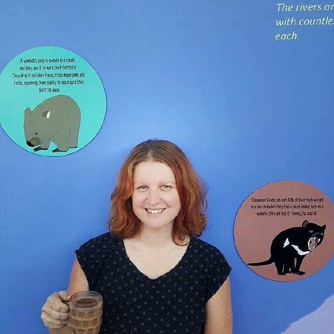 Hobart illustrator Jennifer Cossins with other examples  of her work. Photo: Facebook