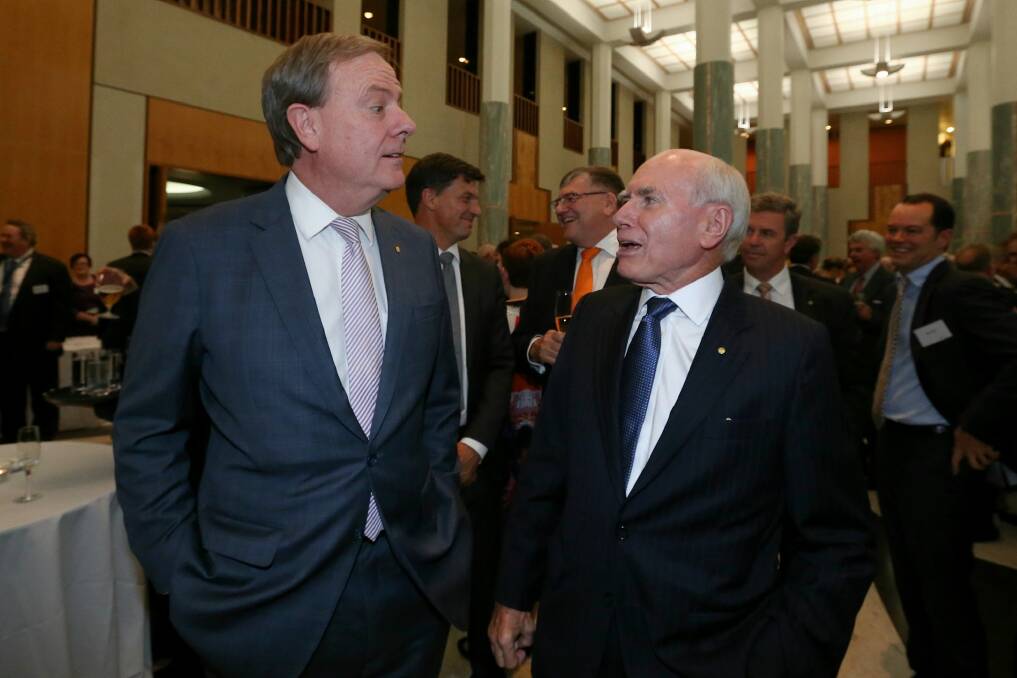 Former treasurer Peter Costello and former prime minister John Howard celebrate the 20th anniversary of Howard's 1996 election victory. Photo: Alex Ellinghausen